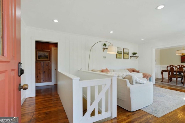 living room featuring recessed lighting, dark wood-style floors, and ornamental molding