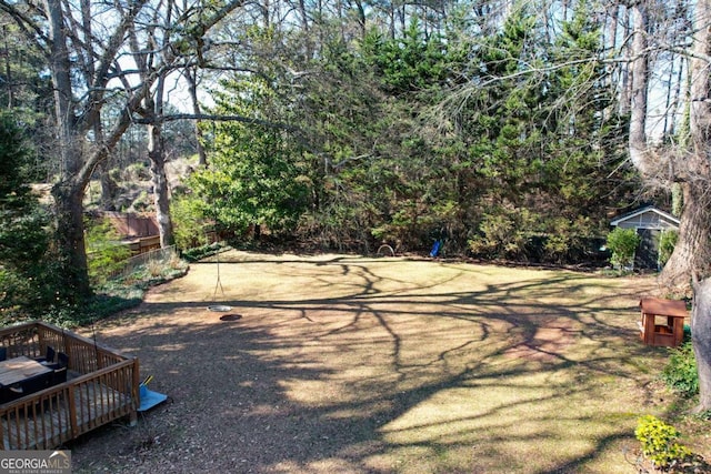 view of yard with a wooden deck