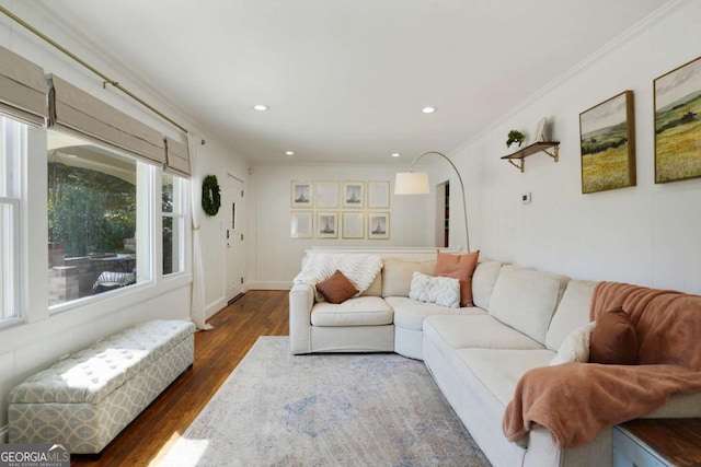 living area featuring recessed lighting, crown molding, and dark wood-style flooring