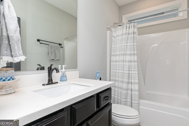 bathroom with vanity, toilet, and shower / bathtub combination with curtain