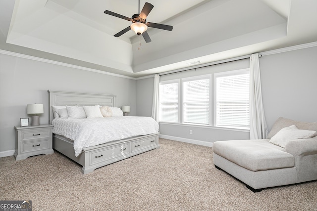 bedroom featuring visible vents, baseboards, carpet, and a tray ceiling