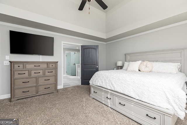 carpeted bedroom with ceiling fan, ensuite bath, baseboards, and ornamental molding