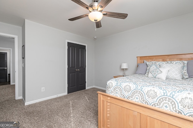 carpeted bedroom featuring a ceiling fan and baseboards