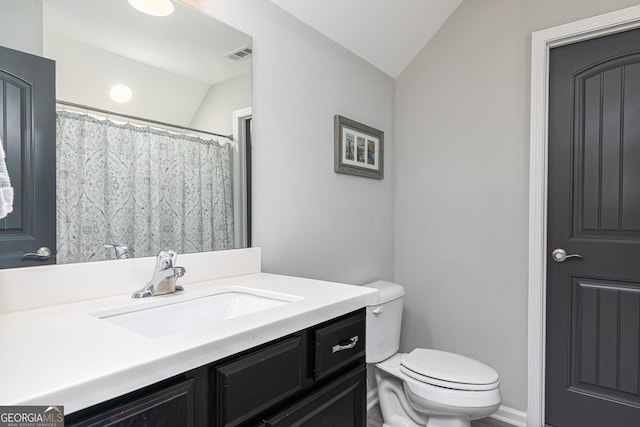 full bath with visible vents, toilet, vanity, and vaulted ceiling