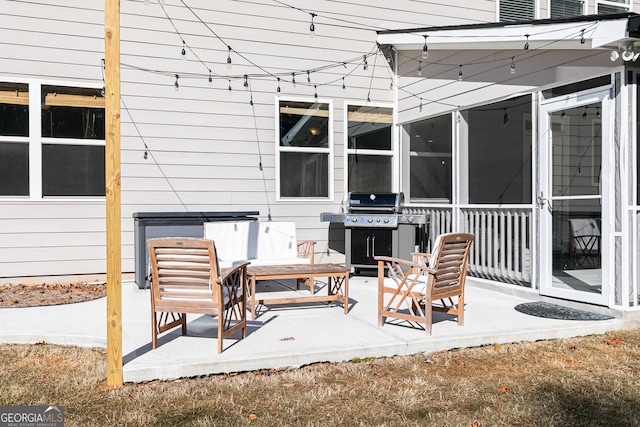 view of patio / terrace with a sunroom and grilling area