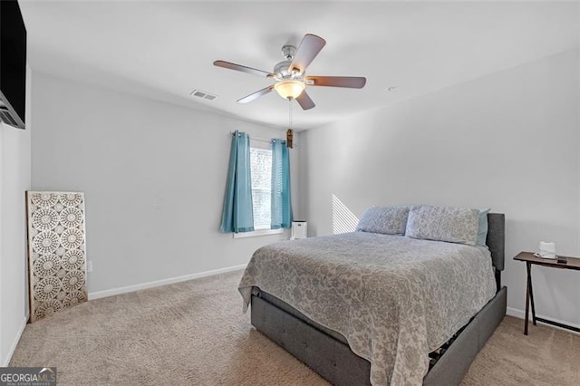 bedroom featuring a ceiling fan, carpet, visible vents, and baseboards