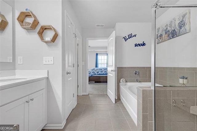 full bath featuring vanity, visible vents, ensuite bath, tile patterned flooring, and a garden tub