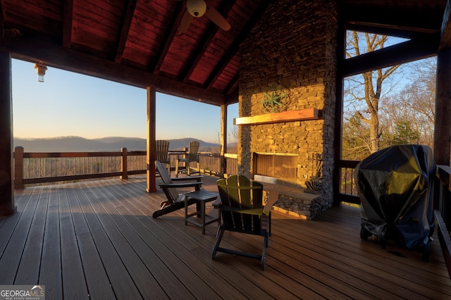 wooden deck with a grill