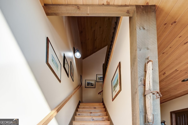 stairs featuring wooden ceiling