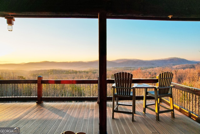 deck at dusk with a mountain view