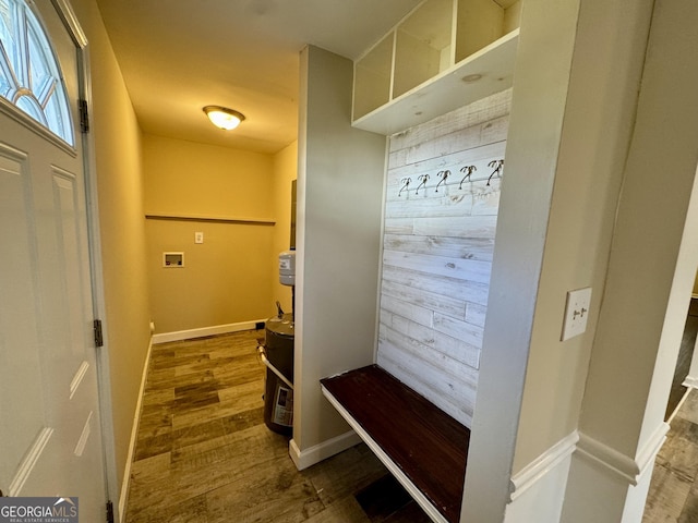 mudroom with baseboards and wood finished floors