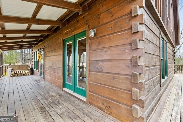 wooden deck featuring french doors