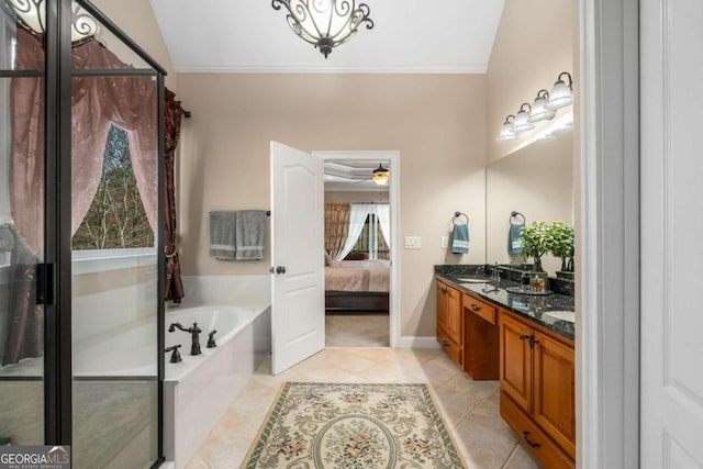 bathroom featuring a garden tub, ornamental molding, ensuite bathroom, and tile patterned flooring