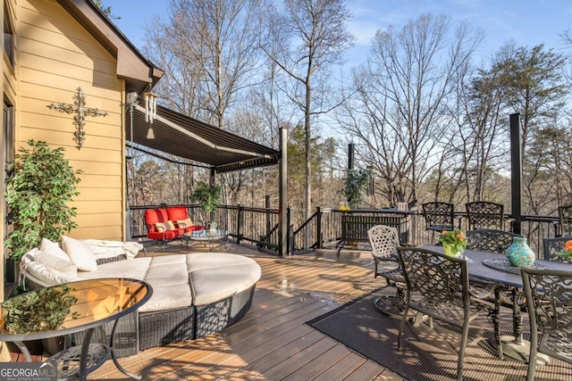 deck featuring outdoor dining space and outdoor lounge area
