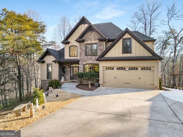 craftsman house with stone siding, board and batten siding, and concrete driveway