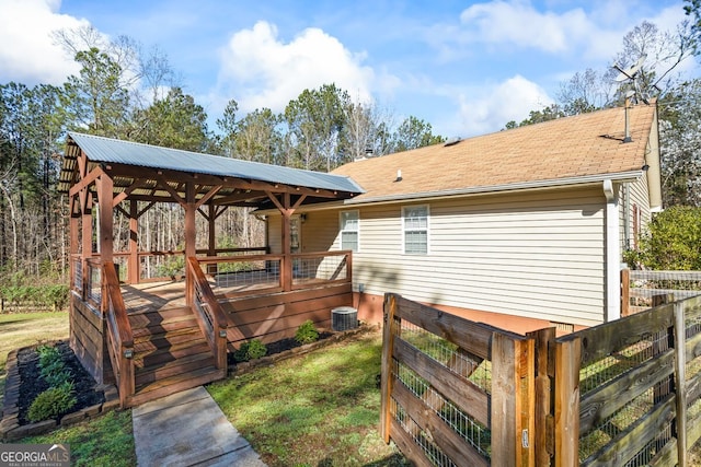 wooden terrace with central AC and fence