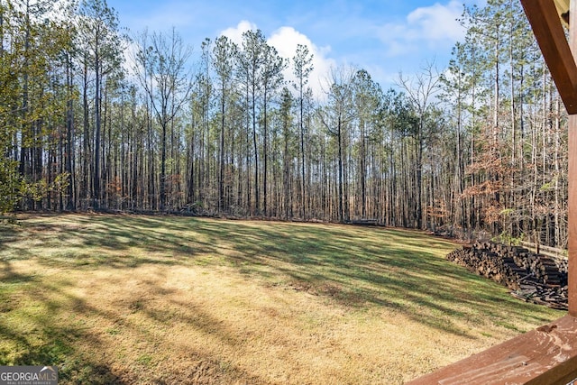 view of yard with a wooded view