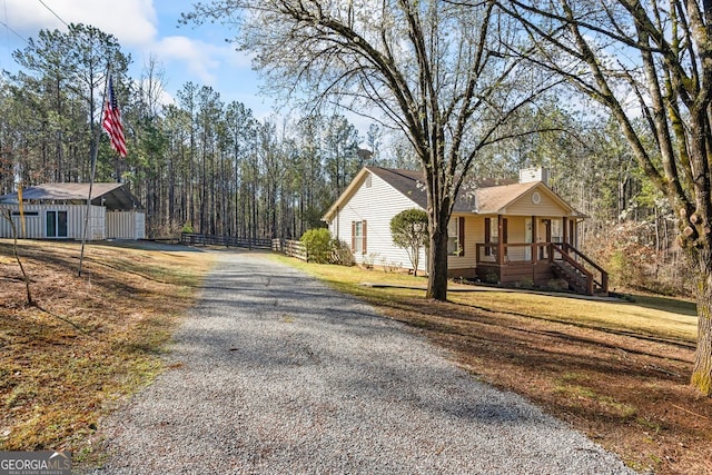 exterior space featuring gravel driveway