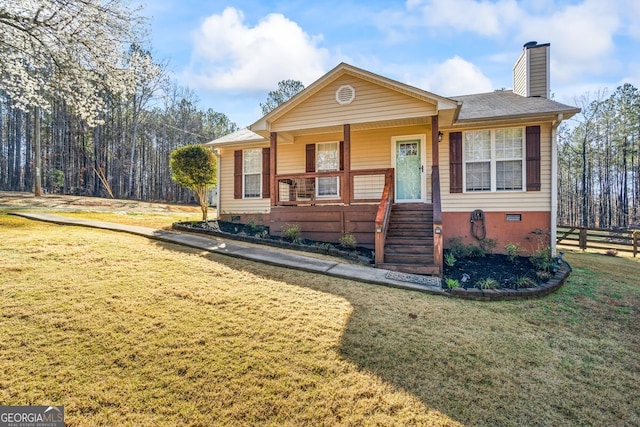 view of front of house featuring crawl space, covered porch, a chimney, and a front yard