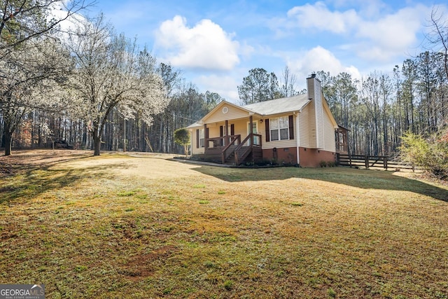 view of home's exterior featuring crawl space, a yard, covered porch, and a chimney