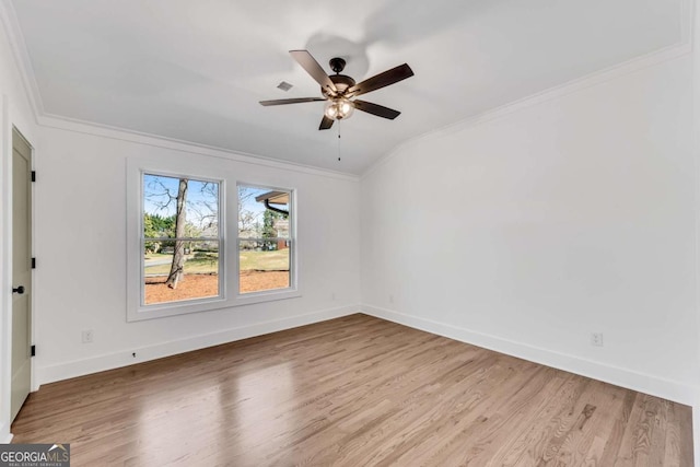 unfurnished room with a ceiling fan, wood finished floors, baseboards, and ornamental molding