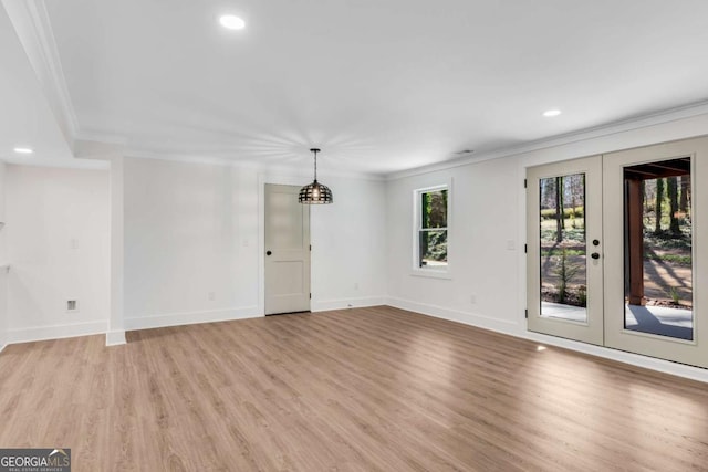 interior space with recessed lighting, baseboards, ornamental molding, and light wood finished floors