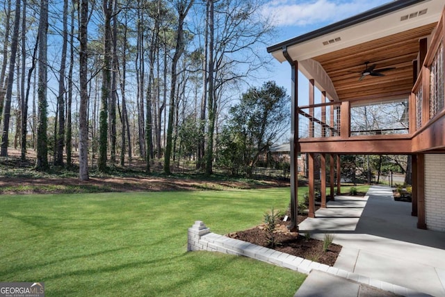 view of yard with ceiling fan