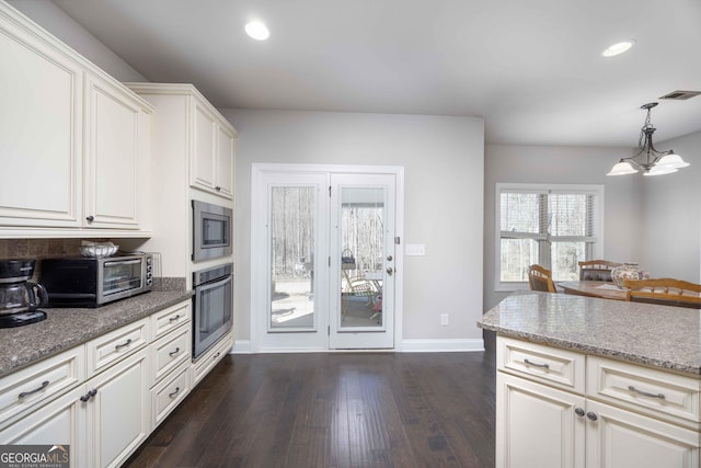 kitchen featuring visible vents, a toaster, recessed lighting, dark wood-type flooring, and appliances with stainless steel finishes