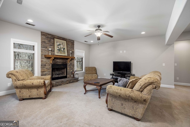 living area with visible vents, light colored carpet, and a healthy amount of sunlight