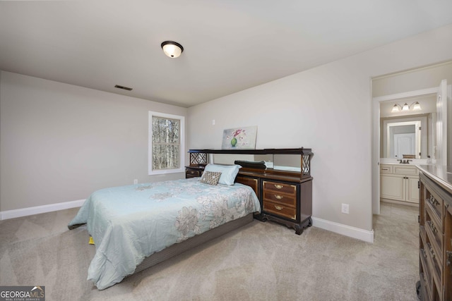 bedroom with light carpet, visible vents, and baseboards