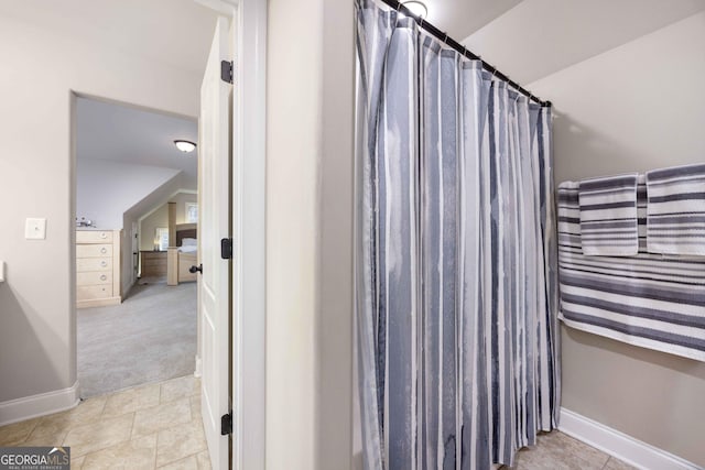 full bathroom featuring tile patterned floors, baseboards, and a shower with curtain