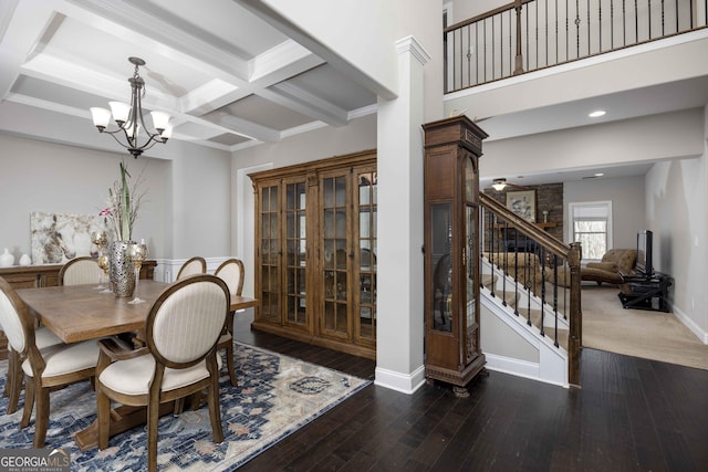 dining room with hardwood / wood-style floors, coffered ceiling, stairs, beamed ceiling, and a notable chandelier