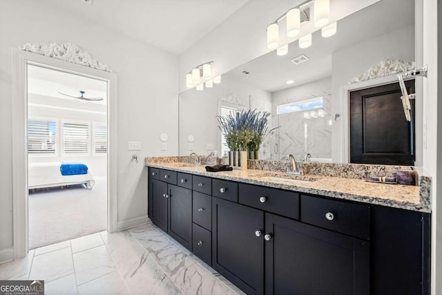 full bathroom with a marble finish shower, visible vents, marble finish floor, and a sink