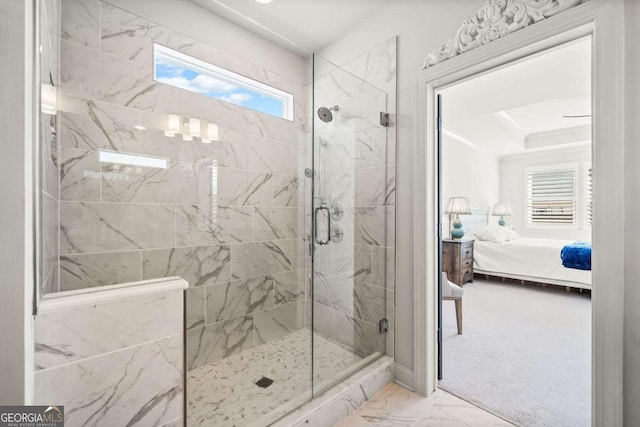 bathroom with a shower stall, connected bathroom, and marble finish floor