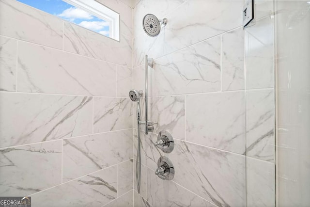 bathroom with tiled shower