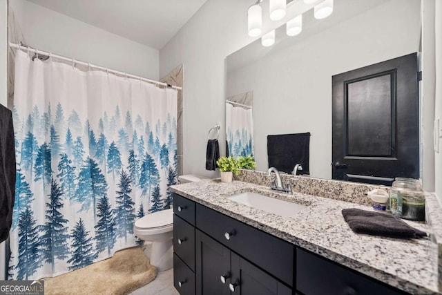 bathroom with a shower with shower curtain, toilet, and vanity