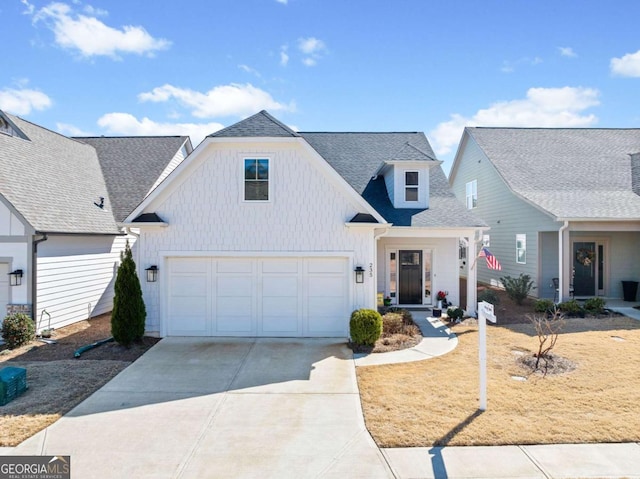 modern inspired farmhouse with a garage, board and batten siding, roof with shingles, and concrete driveway