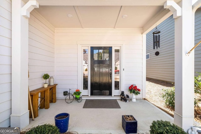 doorway to property featuring a porch