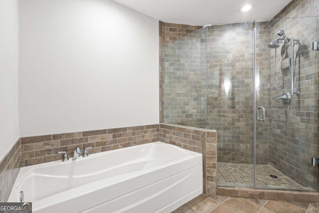 full bath with recessed lighting, a bath, a shower stall, and tile patterned flooring