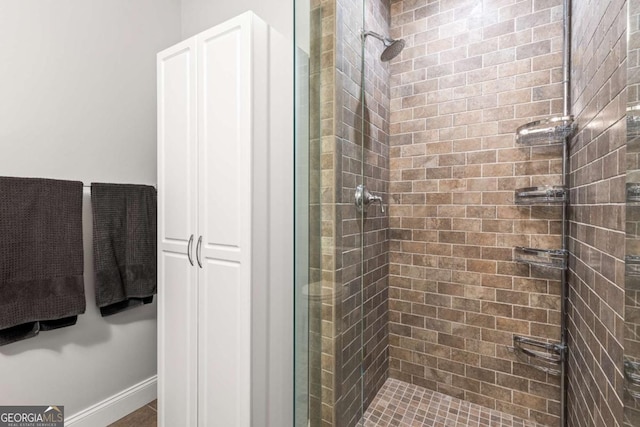 bathroom with a shower stall