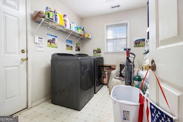 11 Tallulah Ct, Jonesboro, GA 30236 - washroom featuring washer and clothes dryer and light flooring