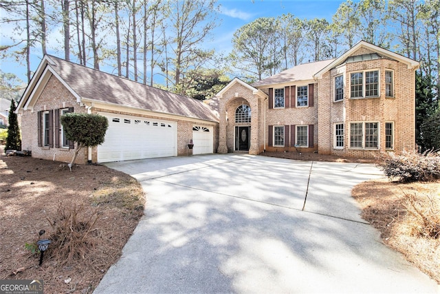 11 Tallulah Ct, Jonesboro, GA 30236 - view of front facade featuring brick siding, driveway, and a garage