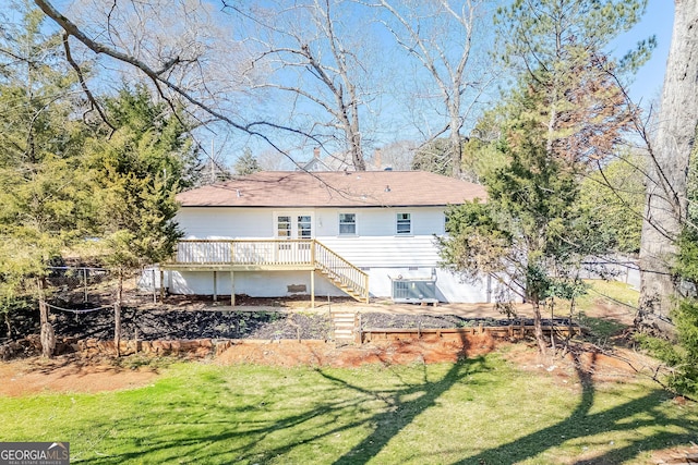 back of house featuring a yard, central AC unit, a wooden deck, and stairs