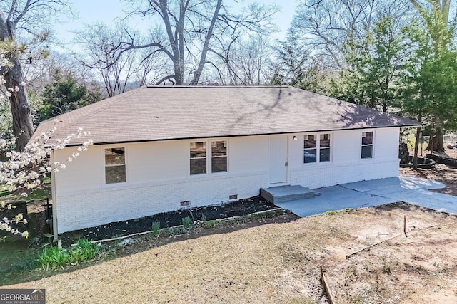 ranch-style home with crawl space, a patio, and brick siding