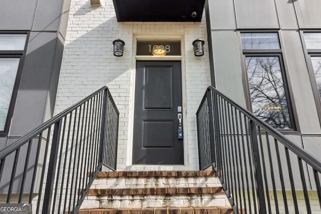 entrance to property with brick siding