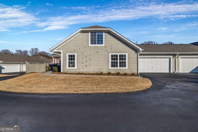 view of front of house featuring an attached garage and driveway