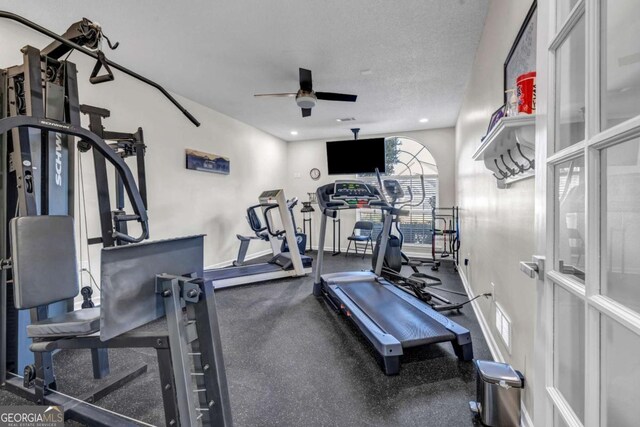 gym with recessed lighting, a textured ceiling, baseboards, and a ceiling fan