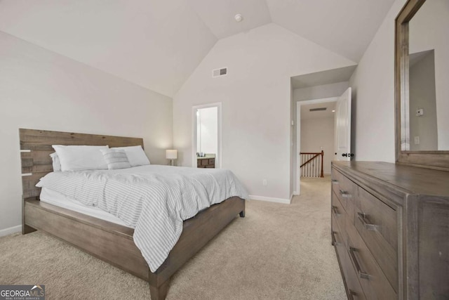 bedroom with high vaulted ceiling, light colored carpet, visible vents, and baseboards