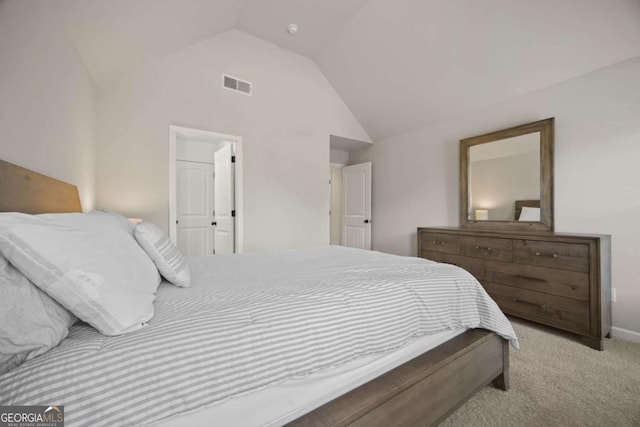 bedroom featuring visible vents, carpet flooring, and vaulted ceiling