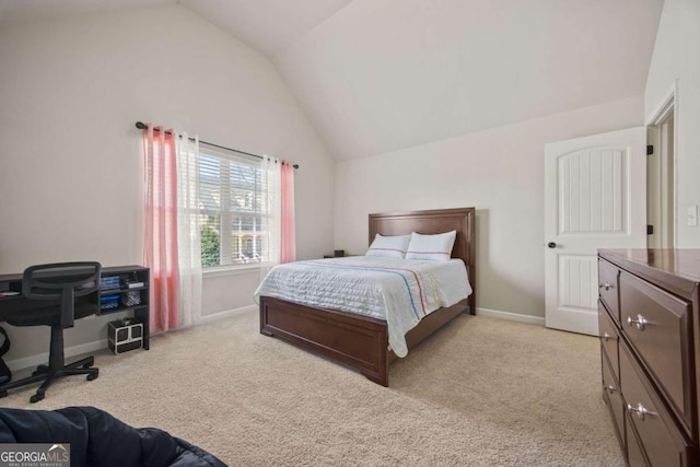 bedroom with lofted ceiling, baseboards, and light carpet